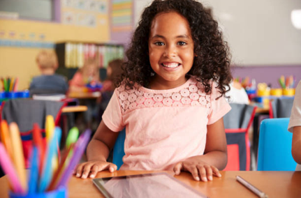 Female early years student smiling and looking at camera